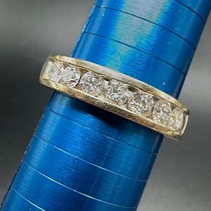 Lot #202 - 14k gold ring with 1 carat of total diamonds  (7.2g) 