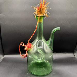 Lot #109  - Decorative green glass bottle 