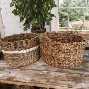 Lot #130  - Pair of large woven storage baskets 