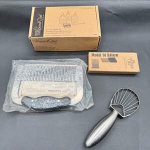 Lot #223  - Pampered chef kitchen items with silver toned napkin rings 