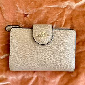 Lot #251  - Authentic Coach bifold wallet 