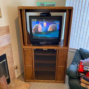 Lot #36 - Entertainment center, Sony TV w/ remote and Insignia digital/analog converter w/remote