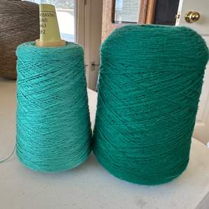 Lot #70 - Two large green spools, 1 cotton, 1 alpaca