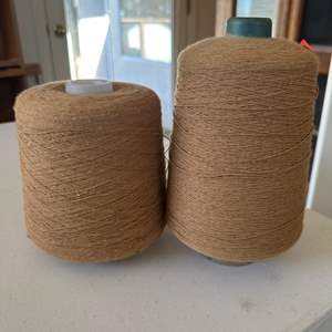 Lot #73 - Two large Tan cotton spools 