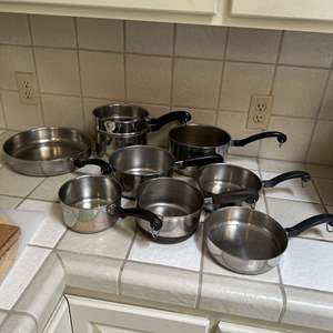 Lot #247 - Revereware stainless pots and pans set 