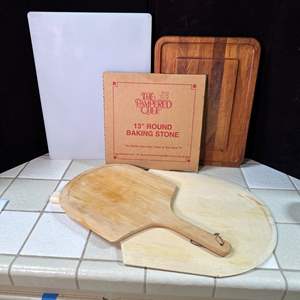 Lot #248 - Baking stone and pizza boards 