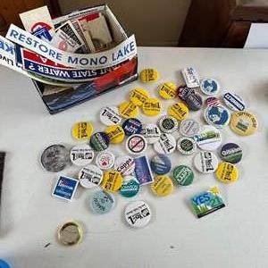 Lot #275 - Political buttons and bumper stickers