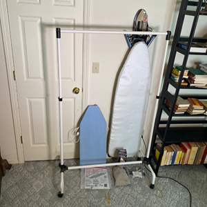 Lot #313 - Ironing boards, iron, steamer, clothing rack and wood hangers