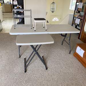 Lot #404 - 6’ folding table, small folding table, stepstool, and NSF rack