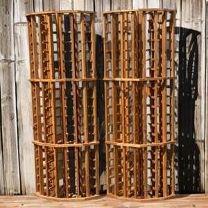 Lot #29  - Pair of curved wooden wine bottle displays. Great condition, lots of bottle storage! Wine country must!