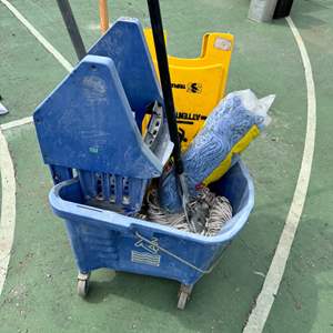 Lot #131  - Janitorial mop bucket and supplies  