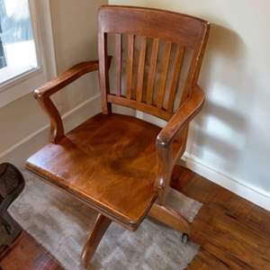 Lot #184  - Vintage swivel solid wood bankers chair 