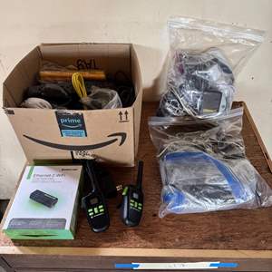 Lot #269  - Assorted electronic cables. Walkies, Charging cables, wireless charging pads, Bluetooth speakers and more 