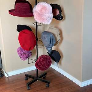 Lot #46- Black Metal Hat Rack on Wheels, & Hat Collection