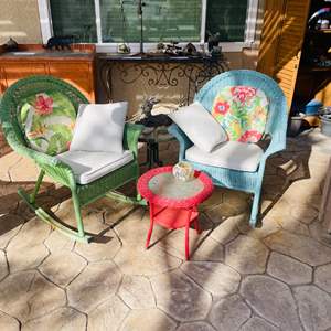 Lot #352- (2) Wicker Chairs, One Is A Rocker, & Small Red Wicker Table, Cushions Included